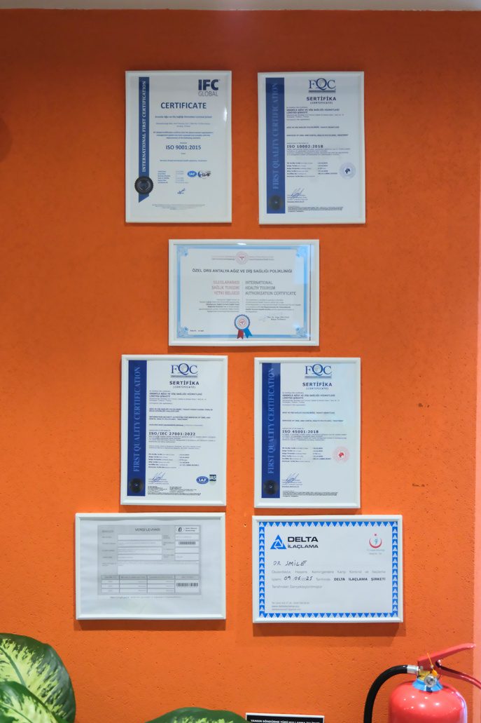 Ministry of Health and ISO certificates displayed at the Dr Smile Antalya clinic